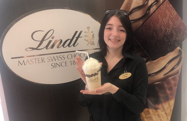 woman holding a chocolate drink